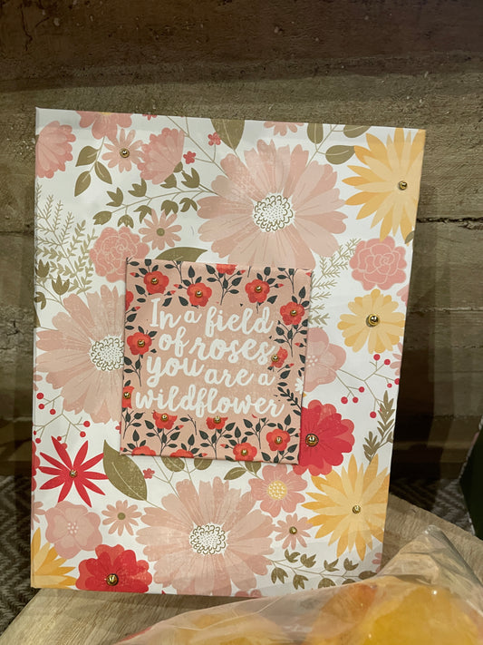 Gift box In a field of roses